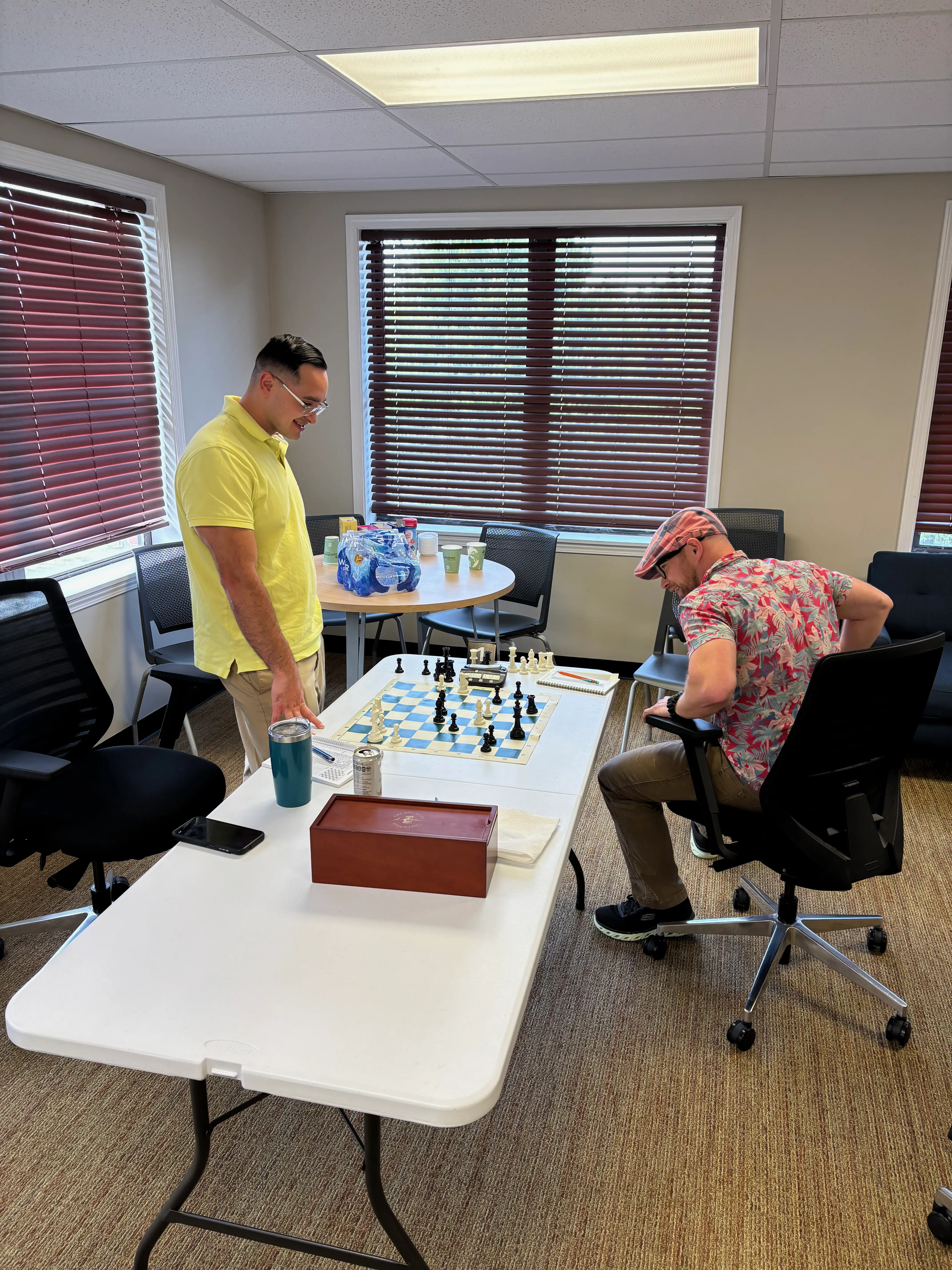 Two players analyzing their game after a tournament round.